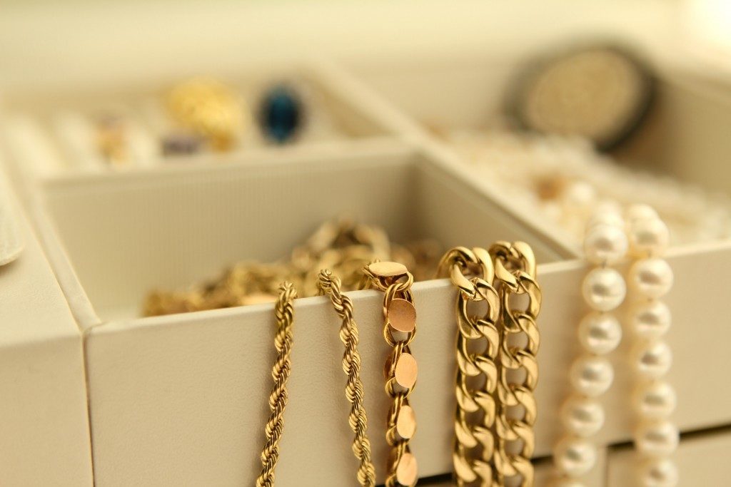 gold chains and pearls in a box